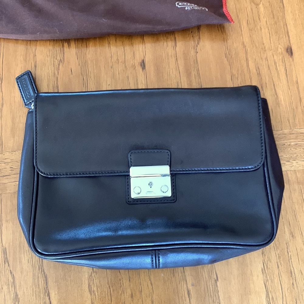 Vintage black Coach new condition leather clutch with lock closure